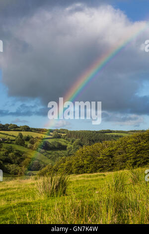 Rainbow over Withypool Common, near Landacre Bridge, Exmoor, UK Stock Photo