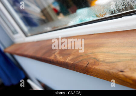 irish reclaimed elm wooden window sill with double glazed window Stock Photo