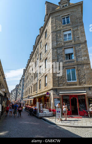 Busy streets full of shoppers and tourists in the walled city of St. Malo, Brittany, France. Stock Photo