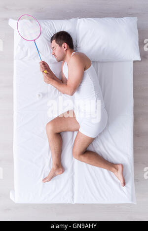 Handsome young man sleeping on bed Stock Photo