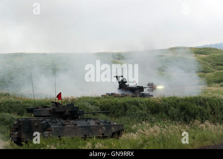 Gotemba, Japan. 28th Aug, 2016. Japanese Ground Self-Defense Forces type 87 self-propelled anti-aircraft guns fire during an annual live fire exercise at the Higashi-Fuji firing range in Gotemba, at the foot of Mt. Fuji in Shizuoka prefecture on Sunday, August 28, 2016. The annual drill involves some 2,400 personnel, 80 tanks and armoured vehicles. Credit:  Yoshio Tsunoda/AFLO/Alamy Live News Stock Photo