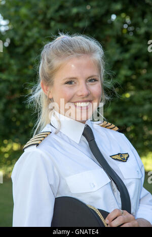 Portrait of a young female pilot in uniform Stock Photo