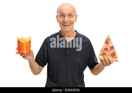 Cheerful elderly man holding a slice of pizza and fries isolated on white background Stock Photo