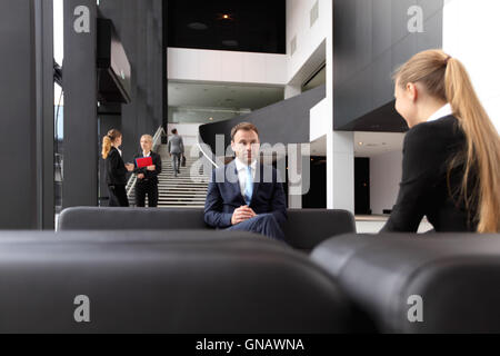 Business people meeting in the lobby of modern building Stock Photo