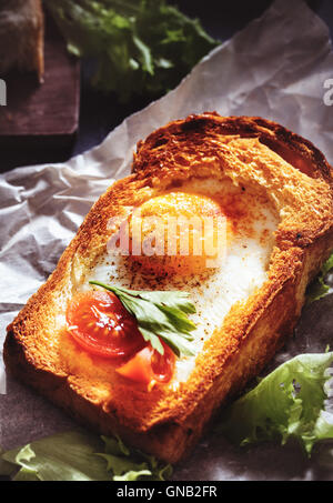 Fried egg in toast closeup Stock Photo