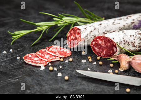 Salami on dark background Stock Photo