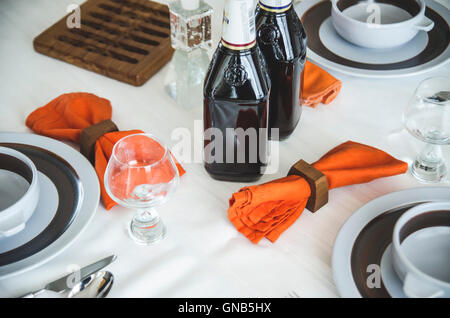 Table Settings with Cloth Napkins, and Kosher Wine for Passover Meal Stock Photo