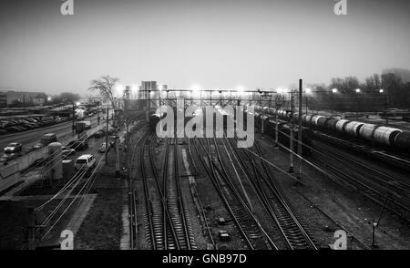 Sorting railway station with cargo trains at night, black and white photo Stock Photo