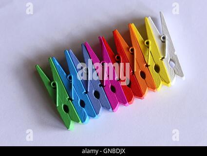 clothespegs party-colored on a white background Stock Photo