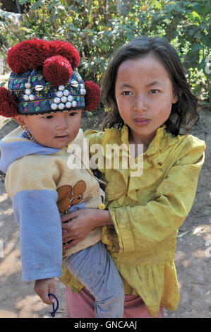 Yao Village, Girl With Young Boy Stock Photo
