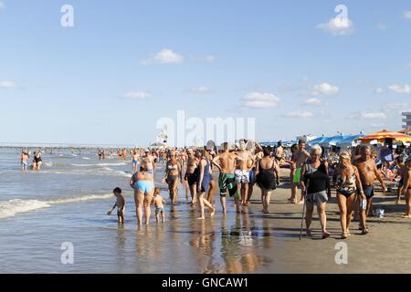 People strolling on the beach of Gatteo a mare in Romagna in Italy on Adriadico sea Stock Photo