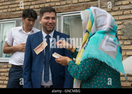 Bandar Torkaman, Turkmen Wedding, Groom Receiving Banknotes As Presents Outside Lunch Venue Stock Photo