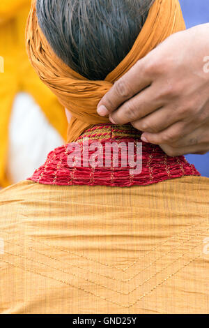 Man doing pagri. Stock Photo