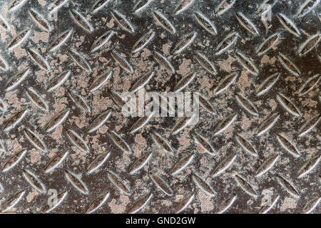 Grungy aluminium dark list with rhombus shapes Stock Photo