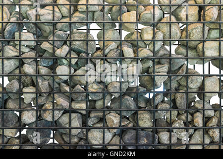 Gabion in close up, Black cage filled with rocks. Isolated.