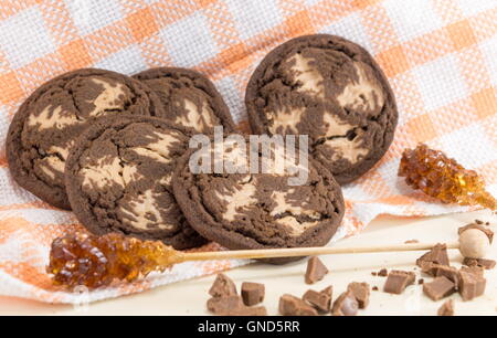 Chocolate chip brown cookies with sugar on orange tablecloth Stock Photo