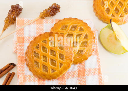 Sweet apple pie round cookies on orange tablecloth Stock Photo