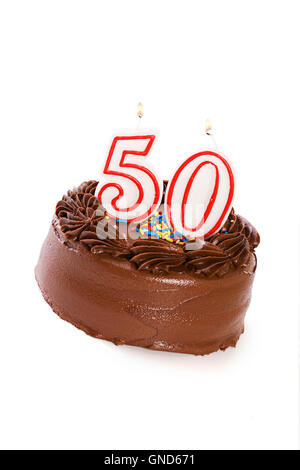 Isolaed on white chocolate frosted cake with various numbered candles on top. Stock Photo