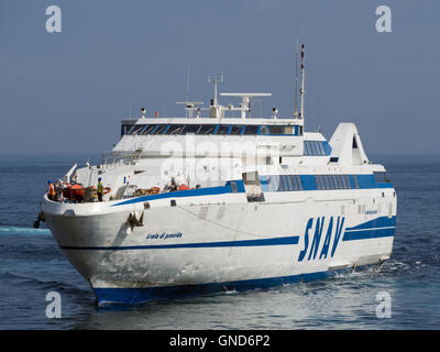 Ferry approaching the Marina Piccola in Sorrento, Italy taking holiday makers to and from the island of Capri or Naples Stock Photo