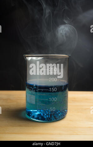 Close up glass measuring beaker for science experiment background Stock Photo