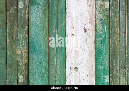 Old, grunge wood panels painted in turquoise color used as background. Stock Photo