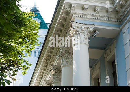 white columns on the facade of the building in classical style Stock Photo