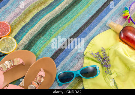 Summer accessories on beach towel top view Stock Photo