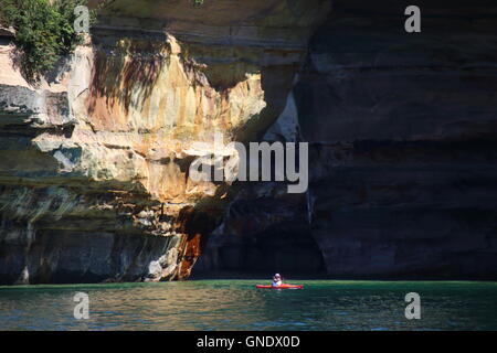 Kayaker in front of Lover's Leap arc at Pictured Rocks National Park, MI, USA Stock Photo