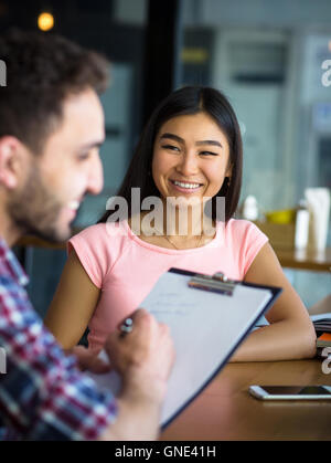 Beautiful lady having interview in restaurant Stock Photo
