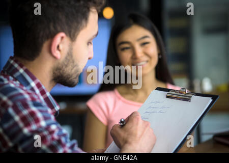 Beautiful lady having interview in restaurant Stock Photo