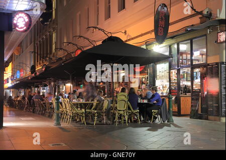 People dine at outdoor restaurant bar in Degraves street in Melbourne Australia. Stock Photo