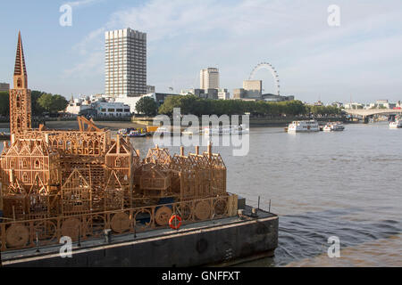London, UK. 31st August, 2016. A 120 metre long wooden sculpture replica of London's skyline from the seventeenth century entitled London 1666 and designed by David Best is moored up on the river Thames in London. The sculpture  will be  lit and burnt in the middle of the Thames on September 4 in a ceremony as part of celebrations to commemorate the 350th anniversary of the Great Fire of London Credit:  amer ghazzal/Alamy Live News Stock Photo