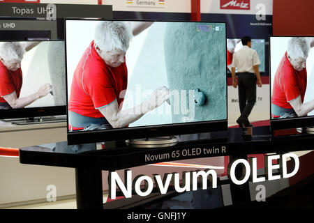 Berlin, Germany. 31st Aug, 2016. Flat-screen televisions on show at the Metz stall during a press day at the IFA international consumer electronics fair in Berlin, Germany, 31 August 2016. The IFA is the world's largest trade fair for entertainment technology, IT, and home appliances. The IFA runs from 2-7 September 2016 at the Berliner Messegelaende exhibition centre. Photo: Rainer Jensen/dpa/Alamy Live News Stock Photo