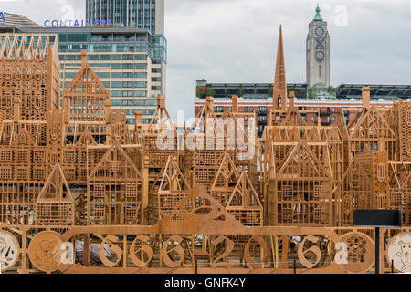 London, UK. 31st August, 2016. Old and new - 350 years of london skyline - A representation of 17th Century London which will be set alight on the River Thames at the weekend marking the 350th anniversary of the Great Fire of London. The 120m lond sculpture was designed by American burn artist David Best in collaboration with Artichoke. Credit:  Guy Bell/Alamy Live News Stock Photo