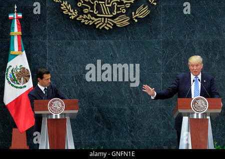 Mexico City, Mexico. 31st Aug, 2016. U.S. Republican presidential candidate Donald Trump (R) addresses a joint press conference with Mexican President Enrique Pena Nieto (L) after their meeting in Mexico City, capital of Mexico, on Aug. 31, 2016. Credit:  Str/Xinhua/Alamy Live News Stock Photo