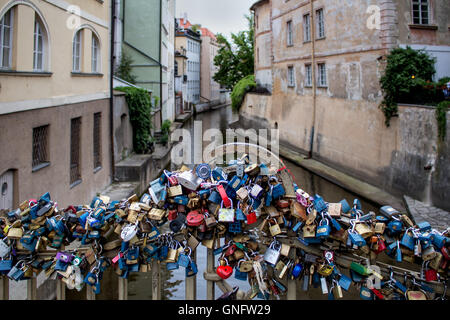 Romantic place on a small bridge in the old city of Prague, used by many couples to lock their love. Stock Photo