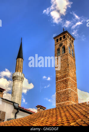 Clock tower and Gazi Husrev-beg Mosque in Sarajevo Stock Photo