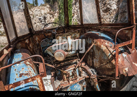 Old abandoned rusted tractor cabin interior Stock Photo