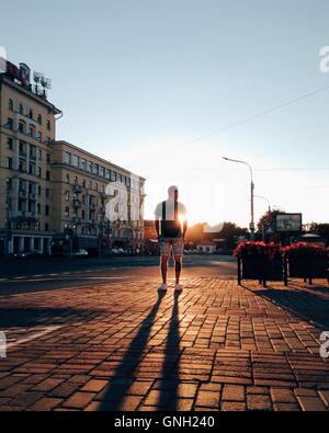 man looking at sunset in the city, Minsk, Belarus Stock Photo