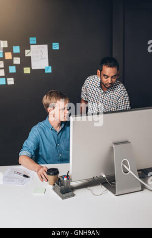 Putting two minds on the task Stock Photo