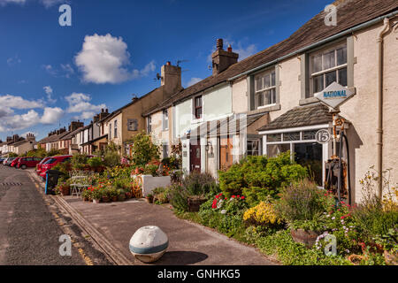 Row of cottages with lovely summer gardens in Main Street, Ravenglass, Cumbria, England, UK Stock Photo