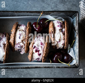 Roasted cherry ice cream sandwiches with salted double chocolate buckwheat cookies (gluten-free) Stock Photo