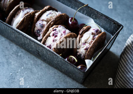 Roasted cherry ice cream sandwiches with salted double chocolate buckwheat cookies (gluten-free) Stock Photo