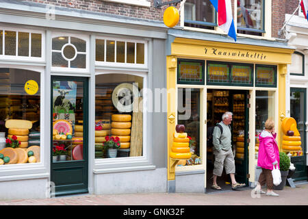 Shoppers and shop front frontage of cheese shop 't Kaaswinkeltje in Lange Tiendeweg Gouda, Holland
