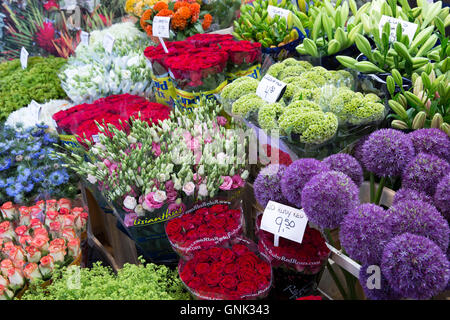 Bunch of bright colour flowers - roses, lillies, allium at famous flower market, Bloemenmarkt in Amsterdam, Holland Stock Photo