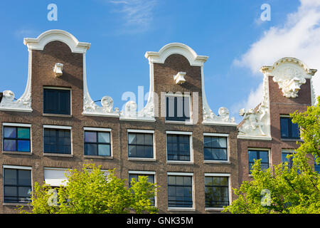 Traditional Dutch architecture - ornate decorative houses in Amsterdam, Holland Stock Photo