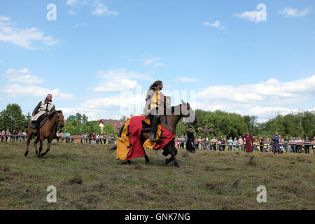 Knights on horse fighting. Medieval festival in Carpatian Troy, Trzcinica near Rzeszow, Poland,2016 Stock Photo