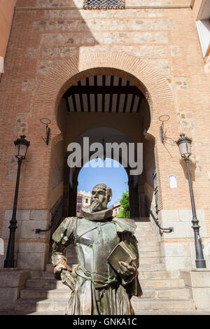 Toledo, Spain - July 28, 2016: statue of the writer Cervantes, located next to Arco de la Sangre, arabic door, Toledo, Spain Stock Photo