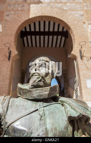 Toledo, Spain - July 28, 2016: statue of the writer Cervantes, located next to Arco de la Sangre, arabic door, Toledo, Spain Stock Photo