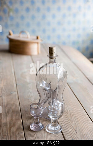 Glass decanter and glasses in period interior  at Den Gamle By, The Old Town, folk museum at Aarhus, Denmark Stock Photo